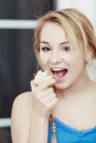 Blond woman teenage girl eating apple healthy fruit. Diet. Royalty Free Stock Photo