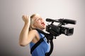 Blond woman with video camera