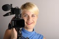 Blond woman with video camera