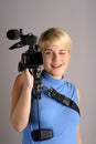 Blond woman with video camera