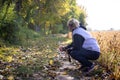 Blond woman walking her dogs having a rest Royalty Free Stock Photo