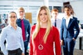 Blond young businesswoman multi ethnic team