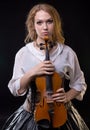 Blond young girl holding the violin Royalty Free Stock Photo