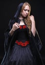 Blond young woman in black hood Royalty Free Stock Photo