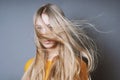 Blond woman with long windswept tousled hair Royalty Free Stock Photo