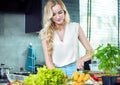 Blonde woman preparing a dinner dish