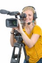 Blond young woman with professional video camcorder, on white Royalty Free Stock Photo