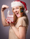 Blonde adult woman is very happy about her christmas gift Royalty Free Stock Photo