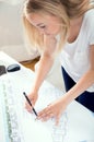 Blonde architect is making amendments Royalty Free Stock Photo