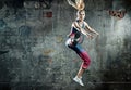 Blonde athlete lady in a jump pose