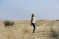 Blonde ballerina dancing in field Royalty Free Stock Photo