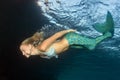 Blonde beautiful Mermaid diver underwater Royalty Free Stock Photo