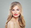 Blonde beauty. Perfect woman with long healthy curly hair, clear skin and red lips makeup. Facial treatment Royalty Free Stock Photo