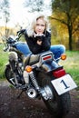 The blonde and big motorcycle Royalty Free Stock Photo