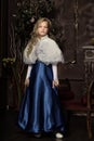 Blonde in a blue Victorian dress Royalty Free Stock Photo
