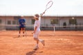 Blonde boy practicing tennis Royalty Free Stock Photo