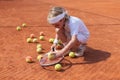 Blonde boy practicing tennis Royalty Free Stock Photo