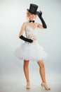 Blonde bride in tophat with veil and long black gloves