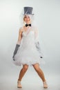 Blonde bride in tophat with veil and long black gloves