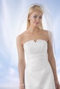 Blonde bride with veil in front of the camera Royalty Free Stock Photo