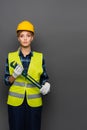 Blonde builder in hardhat holding pipe Royalty Free Stock Photo