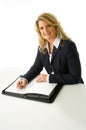 Blonde business woman taking notes Royalty Free Stock Photo