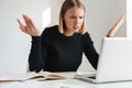 Blonde business woman work with documents and laptop Royalty Free Stock Photo