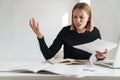 Blonde business woman work with documents and laptop Royalty Free Stock Photo