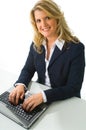 Blonde business woman working on computer