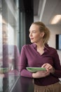 Blonde businesswoman working on tablet at office Royalty Free Stock Photo