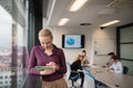 Blonde businesswoman working on tablet at office Royalty Free Stock Photo