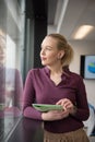 Blonde businesswoman working on tablet at office Royalty Free Stock Photo