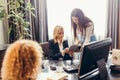 Blonde executive businesswoman doing multitasking work in office. Royalty Free Stock Photo