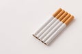 blonde cigarettes with filter on a white table, white background Royalty Free Stock Photo