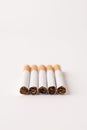 blonde cigarettes with filter on a white table, white background Royalty Free Stock Photo