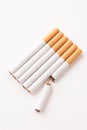 blonde cigarettes with filter on a white table, white background Royalty Free Stock Photo