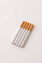 blonde cigarettes with filter on a white table, white background Royalty Free Stock Photo