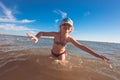 Blonde cute seven-year-old girl having fun and having a good time at the sea during the holidays Royalty Free Stock Photo