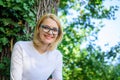 Blonde enjoy natural landscape. Feeling free and relaxed. Woman blonde take break relaxing in park. Girl relaxing green Royalty Free Stock Photo