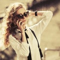 Blonde fashion business woman in sunglasses calling on cell phone Royalty Free Stock Photo