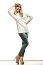 Blonde fashion woman in white shirt denim pants Royalty Free Stock Photo