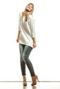 Blonde fashion woman in white shirt denim pants Royalty Free Stock Photo