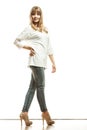 Blonde fashion woman in white shirt denim pants Royalty Free Stock Photo