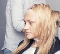 A blonde female client coloring hair Royalty Free Stock Photo