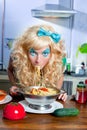 Blonde funny on kitchen eating pasta like crazy Royalty Free Stock Photo