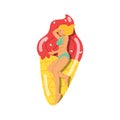 Blonde girl in bikini floating and sunbathing on air mattress in pool or sea. Royalty Free Stock Photo
