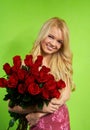 Blonde girl with bouquet roses Royalty Free Stock Photo