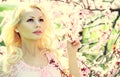 Blonde Girl with Cherry Blossom. Spring Royalty Free Stock Photo