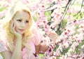 Blonde Girl with Cherry Blossom. Spring Portrait Royalty Free Stock Photo