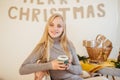 Blonde girl drinking her coffee, eat cookies and read a book Royalty Free Stock Photo